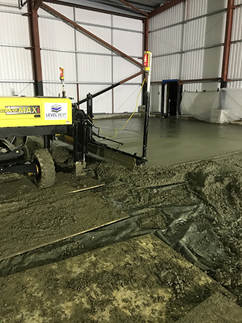 3. The concrete is then compacted and laid to the correct flatness tolerance with one of the companies laser screed concrete flooring machines.