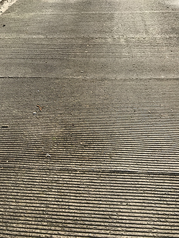 External concrete yard in Bristol with a “combed” surface finish and texture to the concrete slab. The “combed” finish provides an extremely durable surface to the external concrete floor and also lasts a lot longer than a more standard “brush” finish. The “combed” finish creates deeper grooves in the concrete which also offers more traction in wet conditions.
