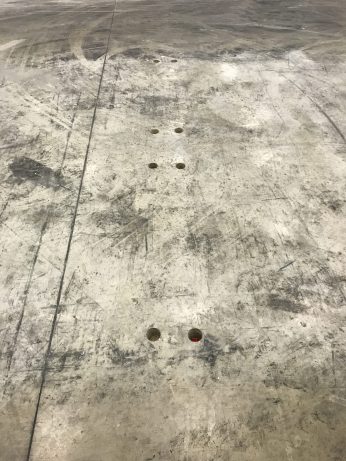 Prior to the FRS being carried out all racking and bolts need to be removed and the floor repaired. Here the bolts have been cored out.