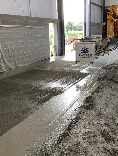 Level Best’s newest innovative topping spreader, ensuring a consistent coloured finish and guaranteed fibre suppression for this D&B floor slab