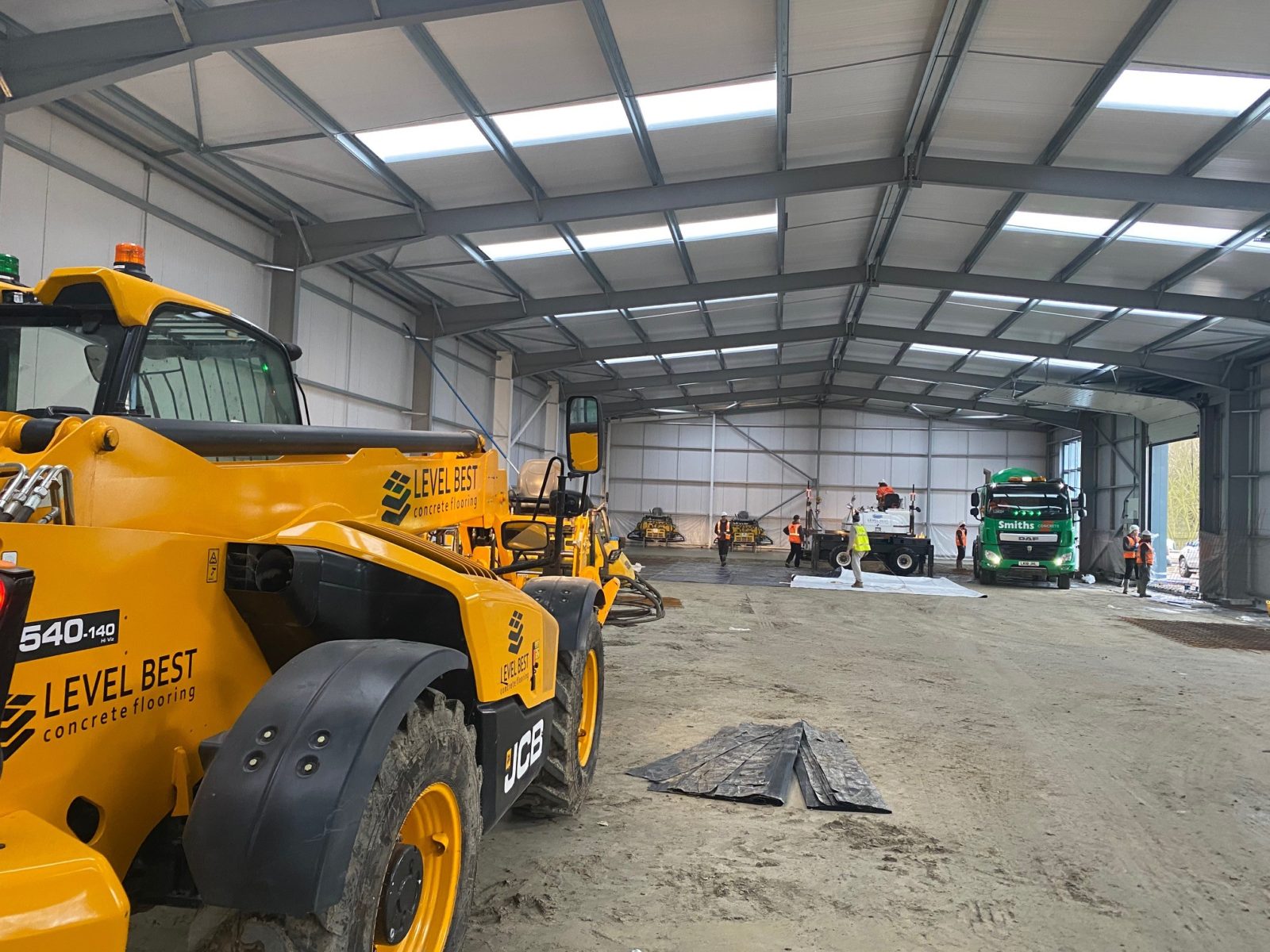 Industrial concrete flooring contractors carry out new warehouse