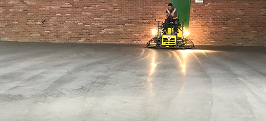 Powerfloated industrial concrete floor slab for new warehouse